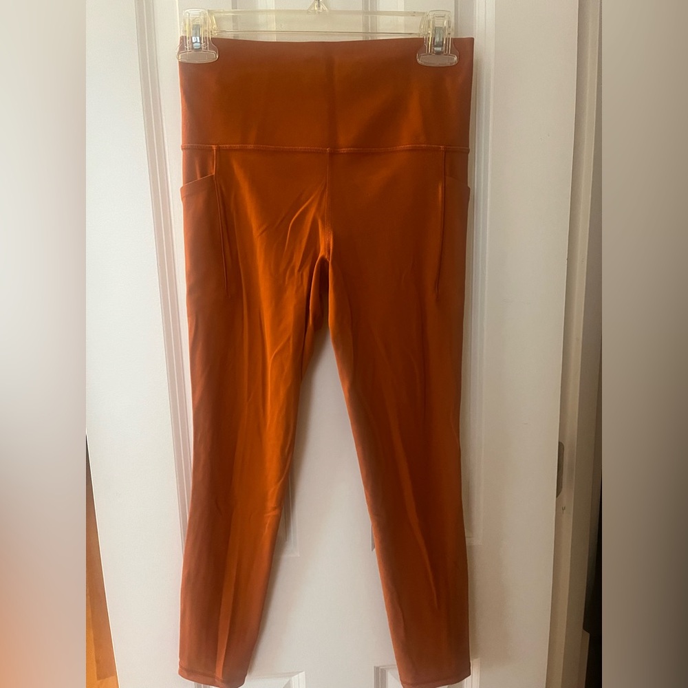 Athleta Orange Leggings with Stash Pocket
